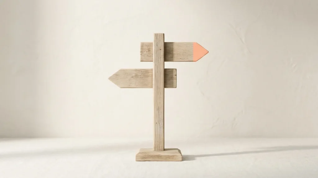 Wooden signpost with two pointing arms